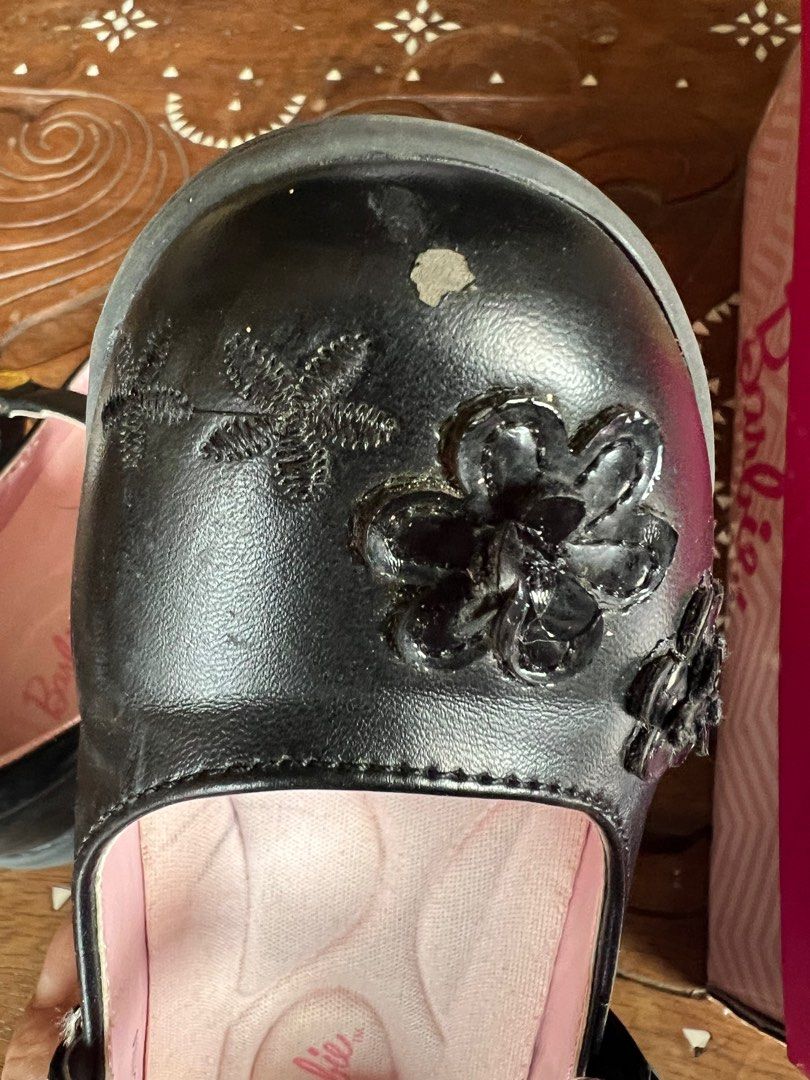 Barbie Aliya Black School Shoes (Category: Babies & Kids Fashion) located in Muntinlupa City. Submitted by emvn (Listing ID 1378949374, Image 3). Description: Well-used Barbie Aliya School Shoes. Black babydoll style with flower design. Size 9-10, fits 4-6yo. Used by my daughter in less than a year - outgrew it within the year. Kept in storage since, still comes with box. Original price is Php1299.75. With minor flaws that can be resolved by clea