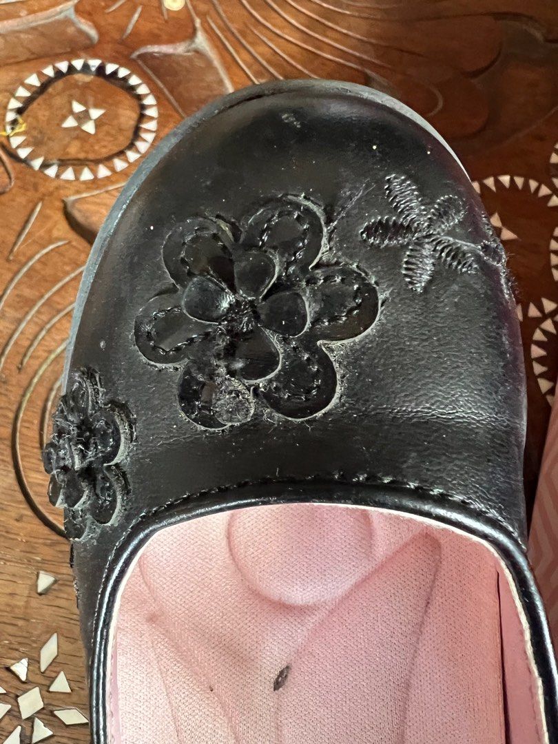 Barbie Aliya Black School Shoes (Category: Babies & Kids Fashion) located in Muntinlupa City. Submitted by emvn (Listing ID 1378949374, Image 2). Description: Well-used Barbie Aliya School Shoes. Black babydoll style with flower design. Size 9-10, fits 4-6yo. Used by my daughter in less than a year - outgrew it within the year. Kept in storage since, still comes with box. Original price is Php1299.75. With minor flaws that can be resolved by clea