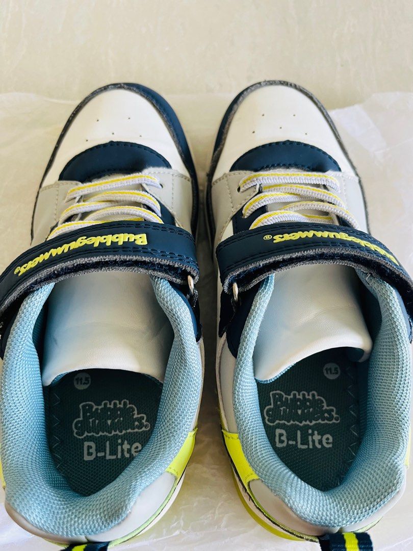 //please pay me directly Not via Carousell as seeing scam buyer//Bubblegummers B-Lite Sneakers - Size 11.5 (Category: Babies & Kids Fashion) located in Singapore. Submitted by tamaiyoko2015 (Listing ID 1378974956, Image 3). Description: - Bubblegummers B-Lite sneakers - Size: 11.5 - Excellent condition - Velcro strap for easy wear - Vibrant color scheme - Perfect for everyday or special occasions - Comes with original box.