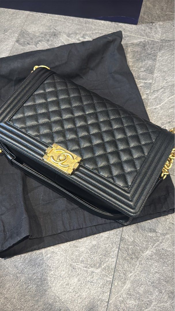Chanel Boy Bag Black Old Medium Caviar GHW (Category: Bags & Wallets) located in Singapore. Submitted by crisscross (Listing ID 1378923144, Image 1). Description: Authentic Chanel Boy Bag in black. Features a quilted design and gold-tone hardware. Includes a dust bag. Minor wear on the corners, otherwise in excellent condition. A classic and stylish piece. Full box set as shown .