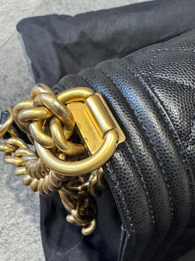 Chanel Boy Bag Black Old Medium Caviar GHW (Category: Bags & Wallets) located in Singapore. Submitted by crisscross (Listing ID 1378923144, Image 2). Description: Authentic Chanel Boy Bag in black. Features a quilted design and gold-tone hardware. Includes a dust bag. Minor wear on the corners, otherwise in excellent condition. A classic and stylish piece. Full box set as shown .