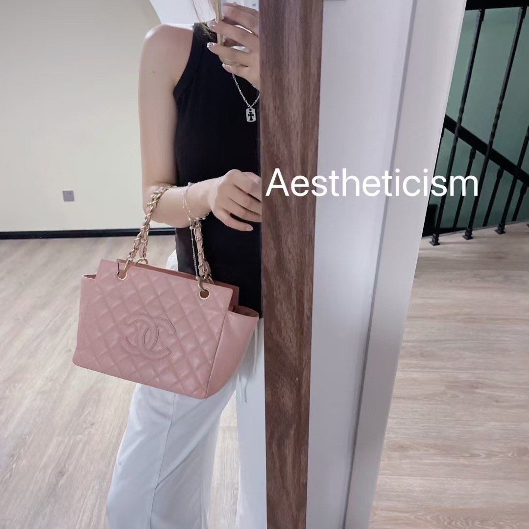 100% authentic Chanel Pink Quilted Tote Bag with Chain Straps (Category: Bags & Wallets) located in Singapore. Submitted by fashionshop1_authonly (Listing ID 1379084149, Image 2). Description: Beautiful pink Chanel tote bag. Features a quilted design, chain straps, and the iconic Chanel logo. Includes a cute bear charm. Perfect for everyday use or special occasions. In excellent condition. Best price already, no more nego! .