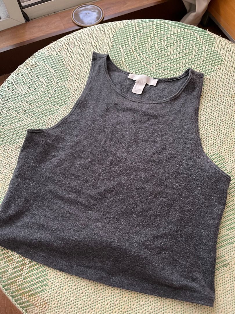 Forever21 grey cropped cotton tank (Category: Sleeveless) located in Manila. Submitted by nikkinat (Listing ID 1379022851, Image 1). Description: Forever21 grey cropped tank. Stretchy. I used to wear this a lot but I think I might have outgrown tight fitting cropped tops. V flattering though. No ww 100 + sf, buyer shoulders sf.