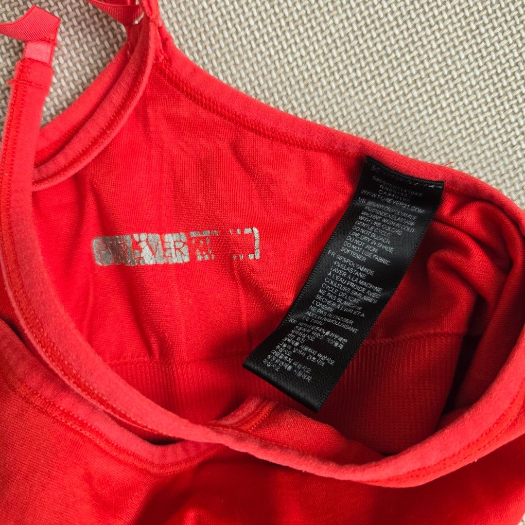 Forever21 Red Sports Bra (Category: Activewear) located in Quezon City. Submitted by ahlexaa (Listing ID 1378994865, Image 3). Description: Brand: Forever 21 Size: XS Color: Red Usage: Lightly used Flaws: None Note this doesn't come with pads 💸 Payments via Gcash only 🚚 Shipping from QC, via Grab/Lalamove, Gogoexpress. Fee c/o buyer ❌️ No returns or exchanges. All sales are final.