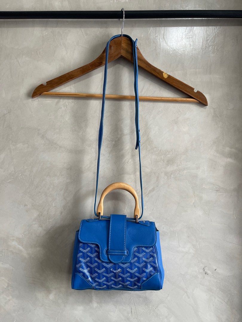 Goyard Blue Mini Goyardine Saigon (Category: Luxury Bags & Wallets) located in Cavite. Submitted by second_story_ph (Listing ID 1378955830, Image 1). Description: Goyard Blue Mini Goyardine Saigon The Mini Saigon features a coated canvas body with leather trim, a wooden top handle, a removable flat leather strap, a front flap with slip-through closure, and an interior slip pocket. It carries an AB condition rating. Reasonable price. Exterior Corn