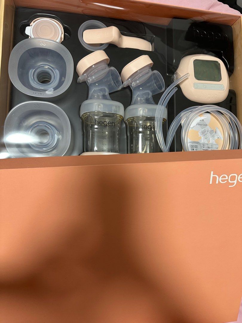 Hegen Double Electric Breast Pump (Category: Breastfeeding & Bottle Feeding) located in Singapore. Submitted by shopwsheena (Listing ID 1379087707, Image 1). Description: Hegen double electric breast pump in excellent condition. Includes all original parts and accessories, bottles, and the main unit. Ready to use. Able to nego. Reason for selling : bought a wearable pump .