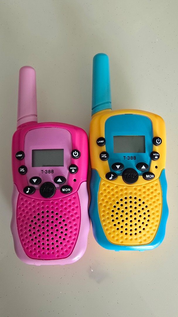 Kids' T388 Walkie Talkies 2pcs - 22 channels (Category: Walkie-Talkie) located in Singapore. Submitted by meiccm (Listing ID 1378936887, Image 3). Description: - Set of two walkie talkies (yellow and pink). - In good working condition, easy to set and use. - Fun for kids indoors and outdoors. - Batteries not included. - Push to talk. - Bought it online for $20++, selling at half price $10. - Self collect at Sengkang, or top up $2.5 for mailing. .