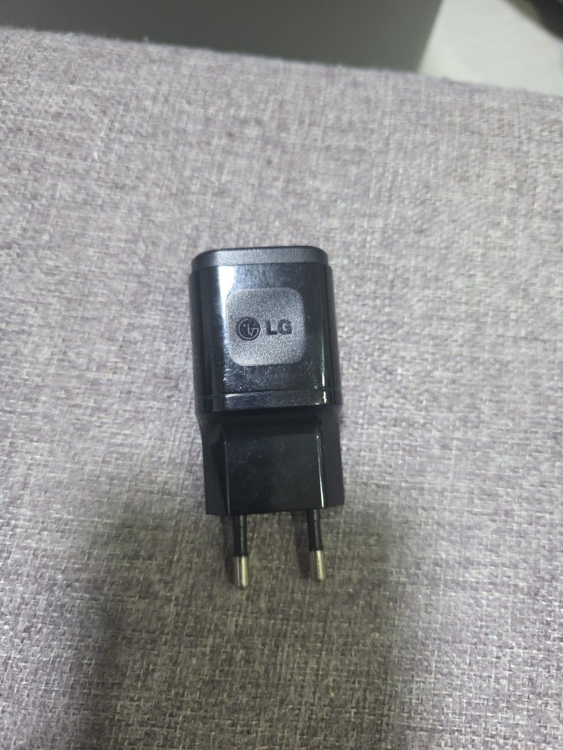 LG USB A Charger (Category: Chargers & Cables) located in Singapore. Submitted by ahsiang1001 (Listing ID 1379090489, Image 3). Description: - Genuine LGcharger - Black color - Compatible with any usb A cable devices - In good working condition - See photos for details.