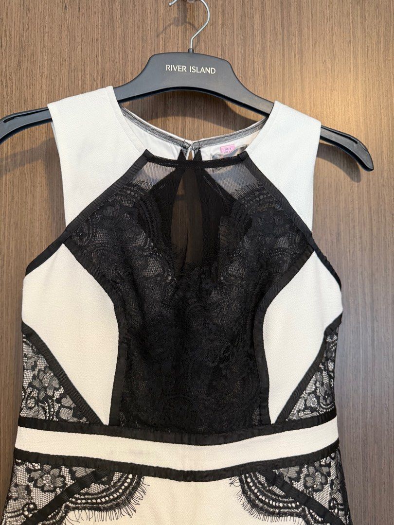 Lipsy White and Black Lace Dress (Category: Dresses) located in Singapore. Submitted by capybaramood (Listing ID 1379103897, Image 3). Description: Elegant Lipsy dress in a classic black and white color combination. Features intricate lace detailing and a flattering silhouette. Perfect for a special occasion or a night out. Brand new with tag.