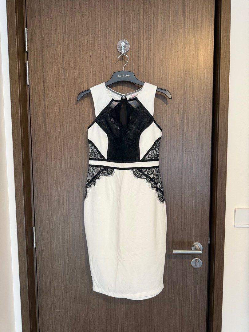 Lipsy White and Black Lace Dress (Category: Dresses) located in Singapore. Submitted by capybaramood (Listing ID 1379103897, Image 2). Description: Elegant Lipsy dress in a classic black and white color combination. Features intricate lace detailing and a flattering silhouette. Perfect for a special occasion or a night out. Brand new with tag.