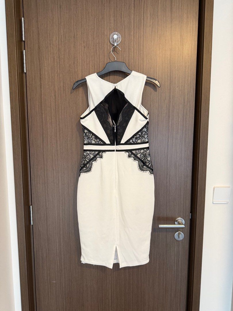 Lipsy White and Black Lace Dress (Category: Dresses) located in Singapore. Submitted by capybaramood (Listing ID 1379103897, Image 1). Description: Elegant Lipsy dress in a classic black and white color combination. Features intricate lace detailing and a flattering silhouette. Perfect for a special occasion or a night out. Brand new with tag.