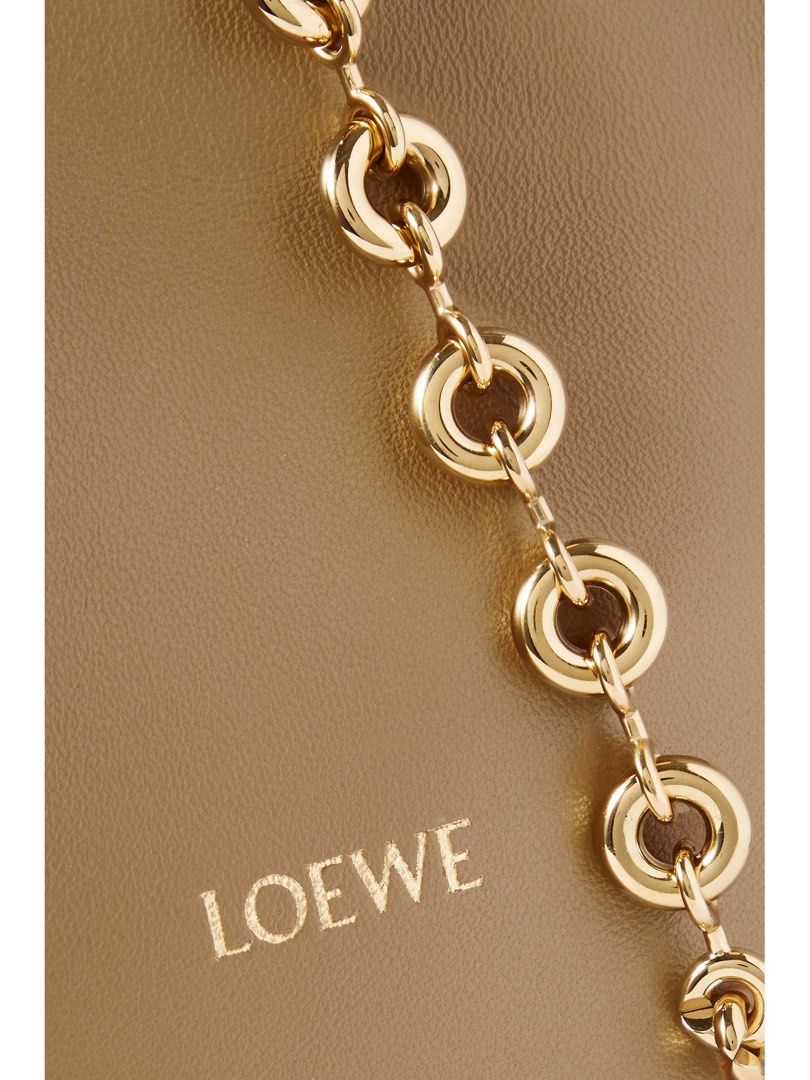 Loewe Squeeze sling bag crossbody bag (Category: Luxury Bags & Wallets) located in Silang. Submitted by girlyouneedthis (Listing ID 1379113912, Image 3). Description: Loewe Squeeze in Brown made from buttery soft leather, this small ‘Squeeze’ style is ruched at the top and has a curved handle with a gold-tone chain. There’s a zipped pocket inside for your phone or keys. Can be a shoulder bag, sling bag and a crossbody bag. Comes with box and dust