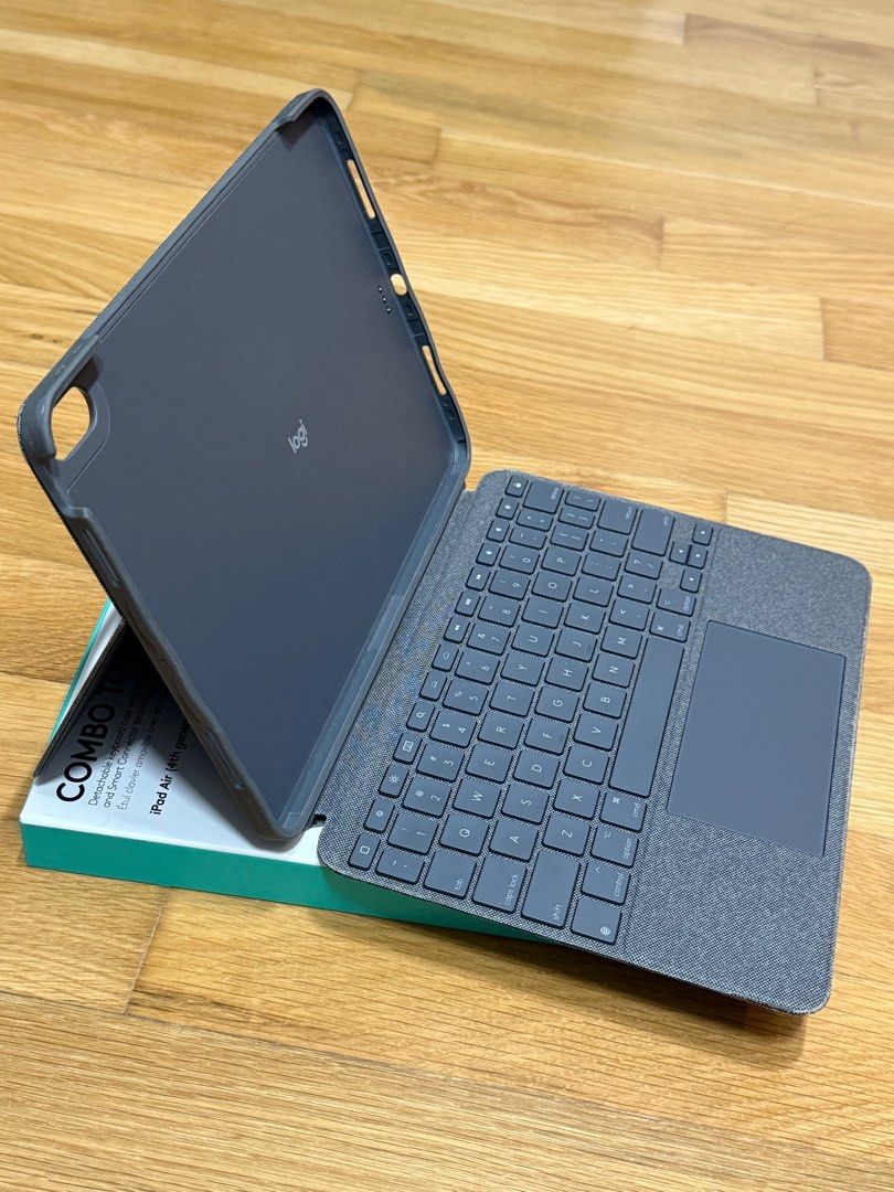 Logitech Combo Touch Keyboard Case for iPad Air (4th Gen) (Category: Cases & Sleeves) located in Singapore. Submitted by unimatrix17 (Listing ID 1379092455, Image 1). Description: Logitech Combo Touch keyboard case for iPad Air (4th generation). Detachable keyboard with trackpad with smart connector, no need charging or pairing. The case is in good condition, and fully functional. Please view images for condition. Comes with original packaging. P