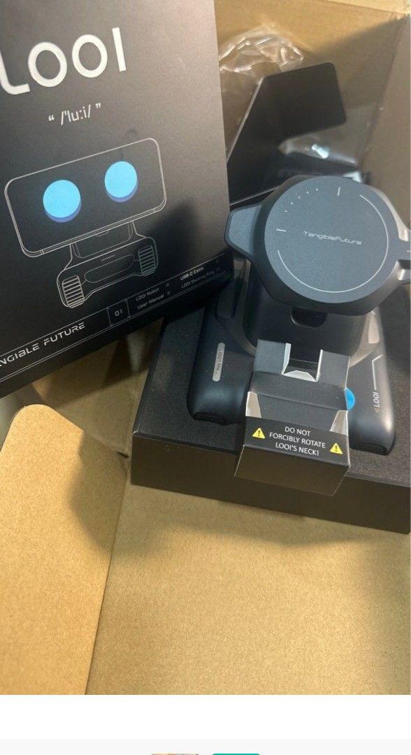 LOOI Robot (Category: Other Gadgets) located in Singapore. Submitted by emy09 (Listing ID 1378942665, Image 3). Description: - LOOI robot - Original packaging - Sleek black design - Includes robot base and box - Ideal for anyone seeking a new robot - price negotiable https://youtu.be/wASH6vyMxjE?si=MifGSFFM0uhlbykS.