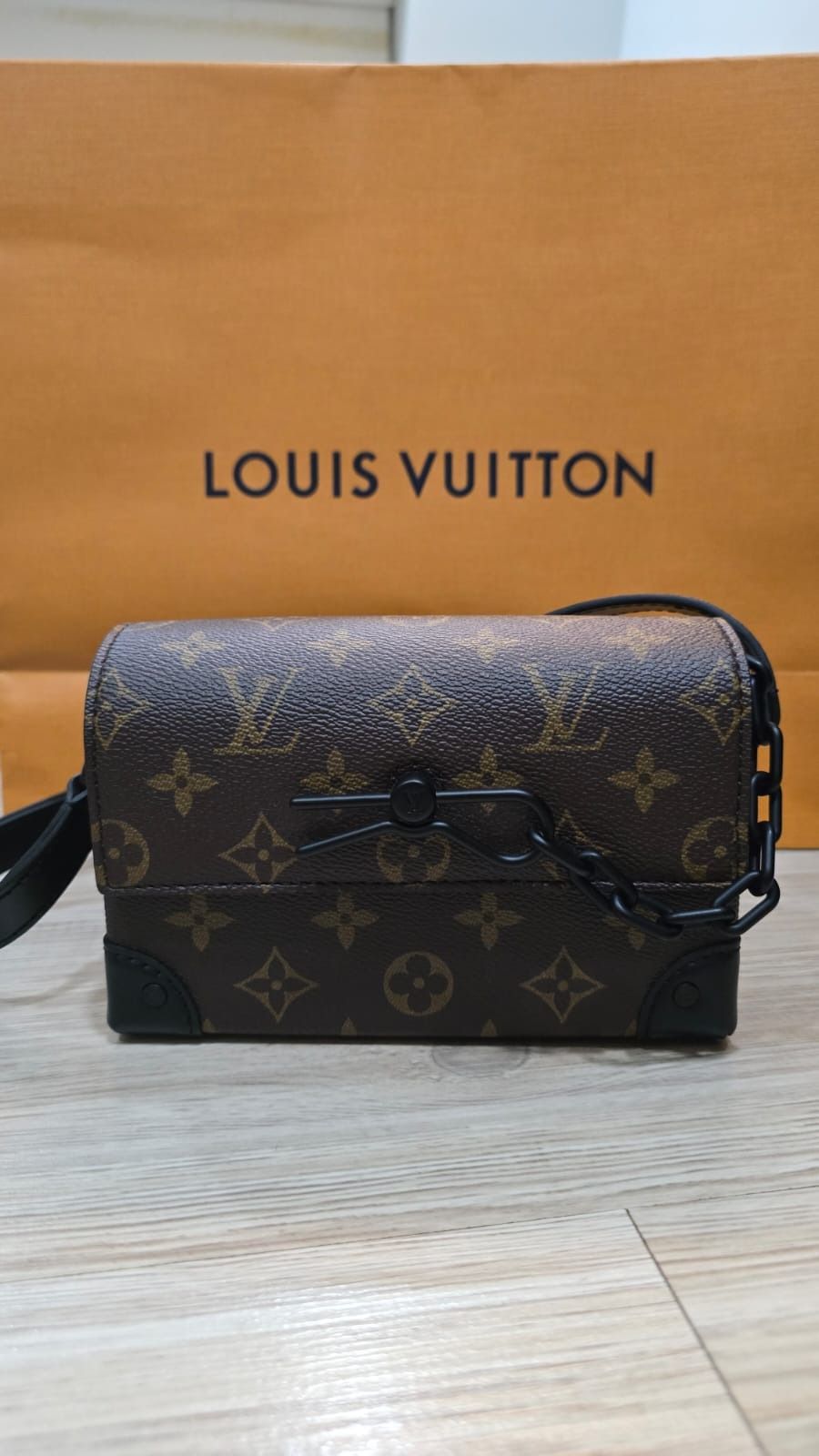 BNIB Authentic Louis Vuitton Steamer Wearable Wallet for Men (Category: Bags & Wallets) located in Singapore. Submitted by queenie89 (Listing ID 1379071215, Image 1). Description: Instantly recognizable by its decorative chain-and-pin signature, the Steamer Wearable Wallet in Monogram Macassar canvas is ideal for smaller essentials. The magnetic closure gives easy access to what’s inside while the shoulder strap adjusts for shoulder and cross-bod