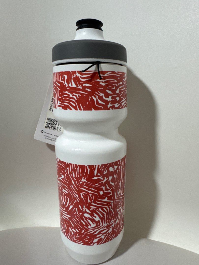 Lululemon water bottle (Category: Garage sale) located in Singapore. Submitted by tlengleng (Listing ID 1379093486, Image 1). Description: Brand new water bottle with a unique red pattern. Features a black cap and a white body. Comes with a tag attached. Perfect for staying hydrated on the go!.