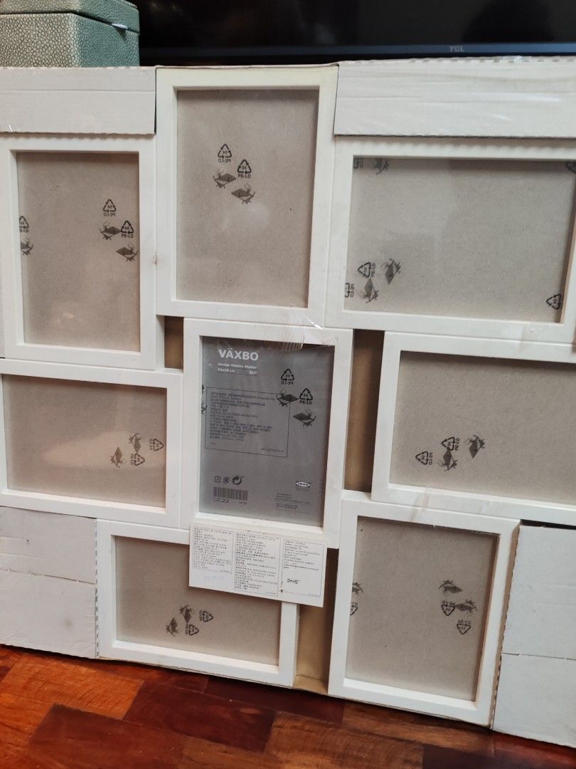Minimalist White Wall Photo Frame (Category: Frames & Pictures) located in Quezon City. Submitted by annemvelez (Listing ID 1379021087, Image 2). Description: Selling brand new (with plastic) wall photo frame. Perfect for family photos. RFS: DECLUTTERING..