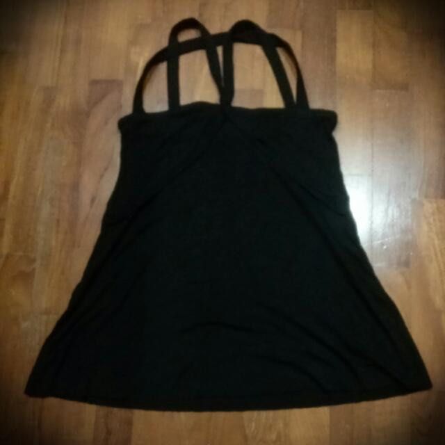 Mphosis Black Halter Neck Dress (Category: Dresses) located in Singapore. Submitted by going_minimalist_reuse_reduce (Listing ID 1379114603, Image 1). Description: This is a black halter neck dress. It has a unique strap design and a flared skirt. The dress appears to be made of a soft, flowing fabric. Perfect for a casual outing or layering..