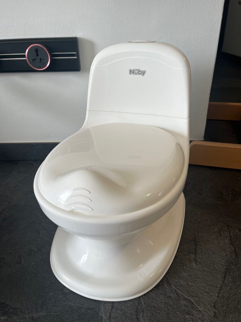 Nuby My Real Potty Training Toilet (Category: Toilet Training) located in Singapore. Submitted by beaniewowo (Listing ID 1378925666, Image 1). Description: This Nuby My Real Potty is in excellent condition. It's a great way to help your little one transition to using the toilet. It's clean and ready to go. Perfect for potty training! Never used and has the flush sound for a real experience!.