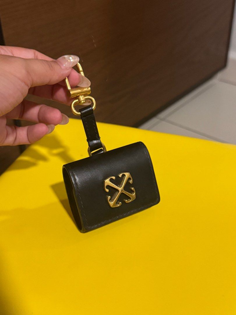 Off-White Arrows Motif Earphone Case (Category: Cases & Sleeves) located in Singapore. Submitted by meowbuy (Listing ID 1379117974, Image 1). Description: Authentic Off White airpod case bought from Farfetch. Moderately used. Self collect at cck 680215 or Midview City.