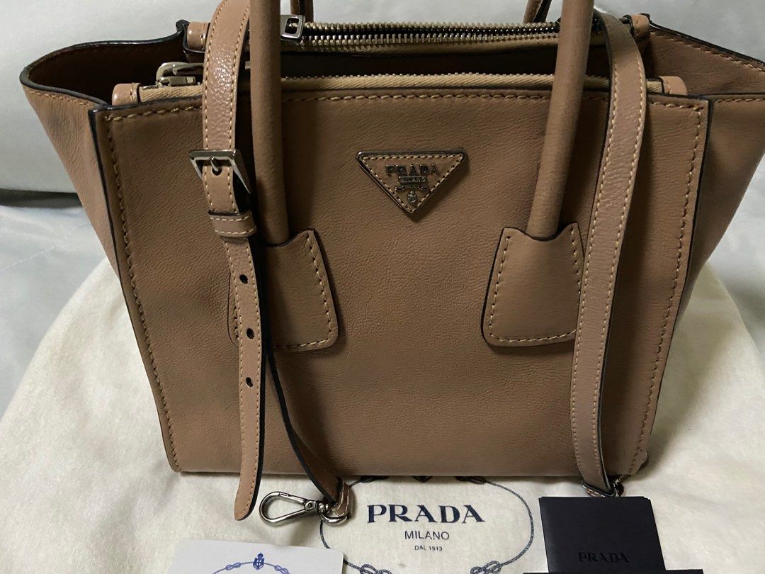 Prada bag (Category: Bags & Wallets) located in Singapore. Submitted by celini (Listing ID 1379073789, Image 2). Description: Bought from Spain 10’years ago. Condition as photo, no stain Authentic card & dust bag 21*27*19cm 100% authentic .
