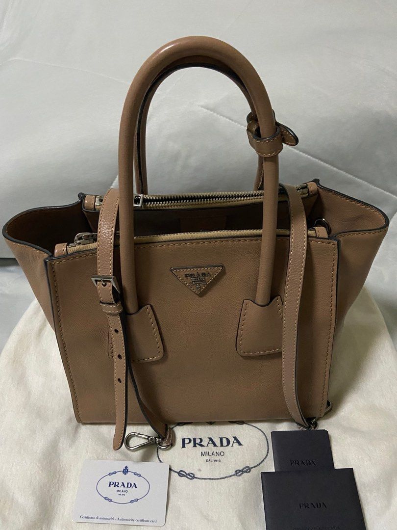 Prada bag (Category: Bags & Wallets) located in Singapore. Submitted by celini (Listing ID 1379073789, Image 1). Description: Bought from Spain 10’years ago. Condition as photo, no stain Authentic card & dust bag 21*27*19cm 100% authentic .