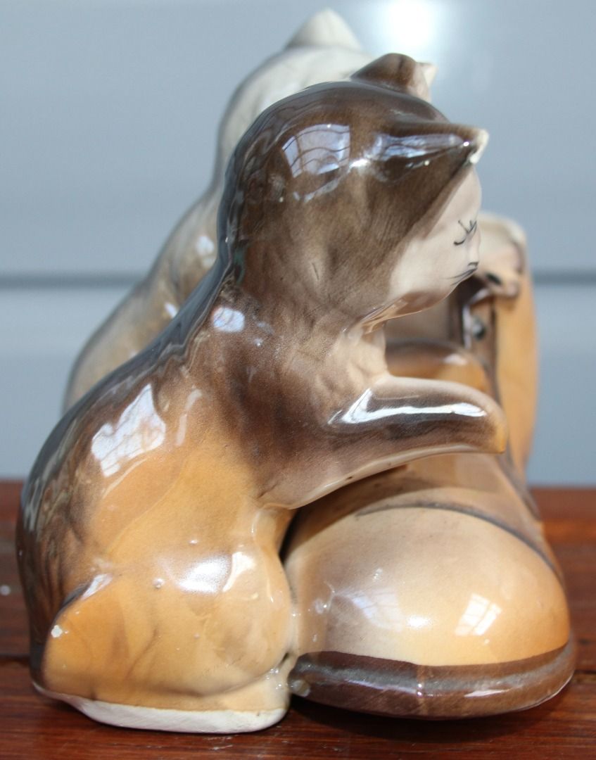 Preloved Vintage Lustre Cat and Boot Vase (Category: Home Decor) located in Burnie. Submitted by tasmanianbeauties (Listing ID 1379046155, Image 2). Description: Preloved Vintage Lustre Cat and Boot Vase Height: 11.5cm Width: 9.8cm Length: 13.5cm Made in Japan. A ceramic vase with cats and a boot. It is in great vintage condition. It is unknown how watertight it is. This item is listed on my website, www.tasmanianbeauties.com.au, with Paypal and 