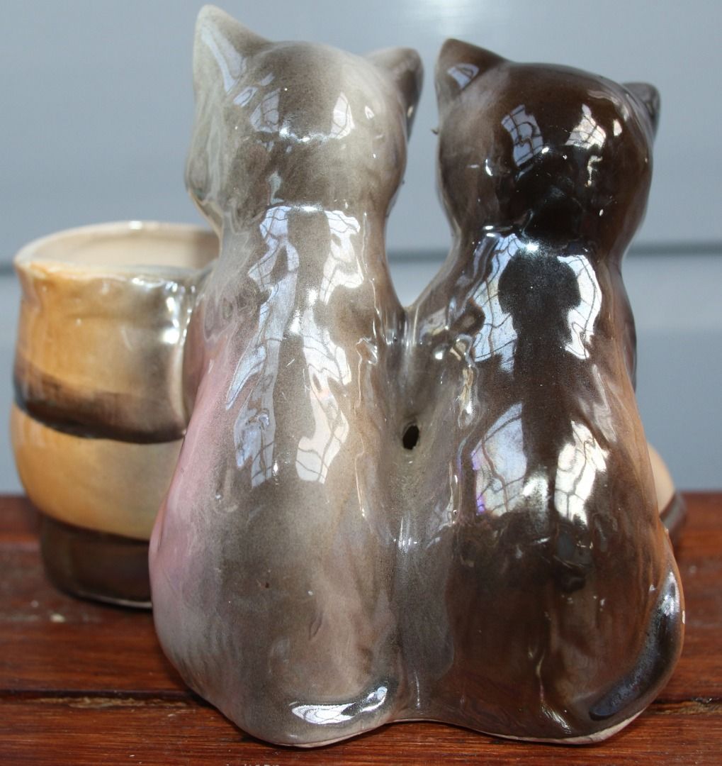 Preloved Vintage Lustre Cat and Boot Vase (Category: Home Decor) located in Burnie. Submitted by tasmanianbeauties (Listing ID 1379046155, Image 3). Description: Preloved Vintage Lustre Cat and Boot Vase Height: 11.5cm Width: 9.8cm Length: 13.5cm Made in Japan. A ceramic vase with cats and a boot. It is in great vintage condition. It is unknown how watertight it is. This item is listed on my website, www.tasmanianbeauties.com.au, with Paypal and 