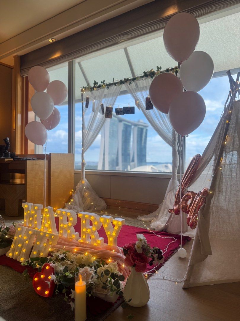 Proposal setup (Category: Everything Else) located in Singapore. Submitted by theduoplanner (Listing ID 1378942298, Image 2). Description: Proposal setup for outdoors $268, inclusive of set up & tear down 2 hours rental ✅ Teepee tent ✅ Backdrop with x10 printed pictures ✅ MARRY ME LED lights, fairy lights ✅ LED candles ✅ Mats, pillow, faux floral arrangement.