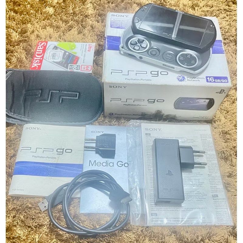 PSPGo 16GB Piano Black (Category: PlayStation) located in General Trias. Submitted by miggys_booth (Listing ID 1378959110, Image 2). Description: [RARE CIB] Sony PSP Go 16GB Piano Black + 64GB Full Games 🎮 Own the sleekest piece of PlayStation history. The PSP Go is the ultimate pocket console—famous for its sliding screen and premium build. This is a Complete in Box (CIB) collector’s set with matching serials and a massive storage upgrade. ⭐ WH