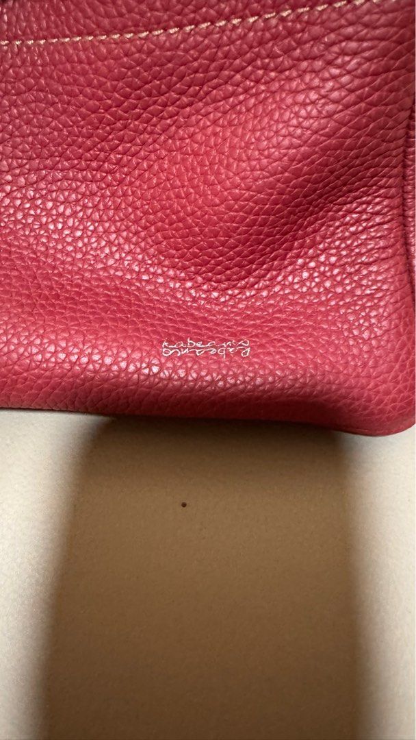 Rabeanco Red Leather Handbag (Category: Bags & Wallets) located in Singapore. Submitted by ikljn (Listing ID 1379090268, Image 1). Description: Beautiful handbag in a rich red leather and a secure clasp closure. The bag has a structured shape and a pebbled leather texture. Interior includes two small pocket. In excellent condition, with receipt.