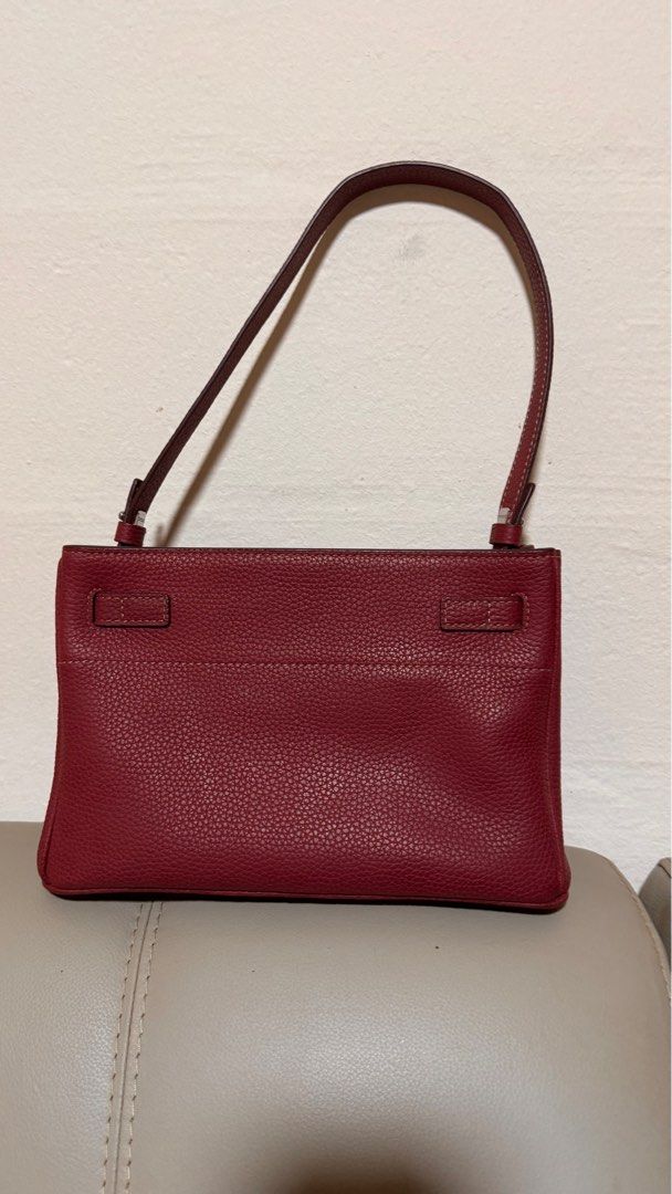 Rabeanco Red Leather Handbag (Category: Bags & Wallets) located in Singapore. Submitted by ikljn (Listing ID 1379090268, Image 3). Description: Beautiful handbag in a rich red leather and a secure clasp closure. The bag has a structured shape and a pebbled leather texture. Interior includes two small pocket. In excellent condition, with receipt.