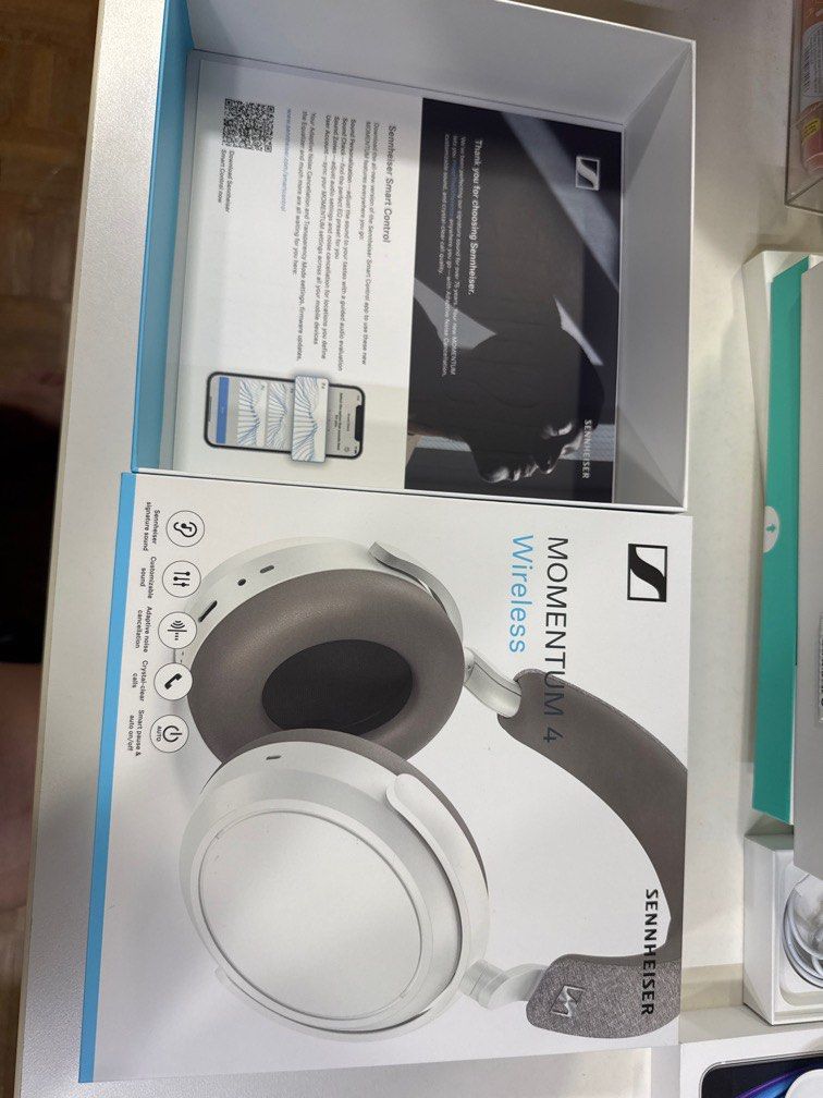 Sennheiser Momentum 4 Wireless Headphones - White (Category: Headphones & Headsets) located in Singapore. Submitted by befluffyunicorn (Listing ID 1378982385, Image 3). Description: Brand new Sennheiser Momentum 4 Wireless headphones in white. Comes with all original accessories, including a carrying case, charging cable, and adapters. Features adaptive noise cancellation and crystal clear calls. Ready for immediate sale..