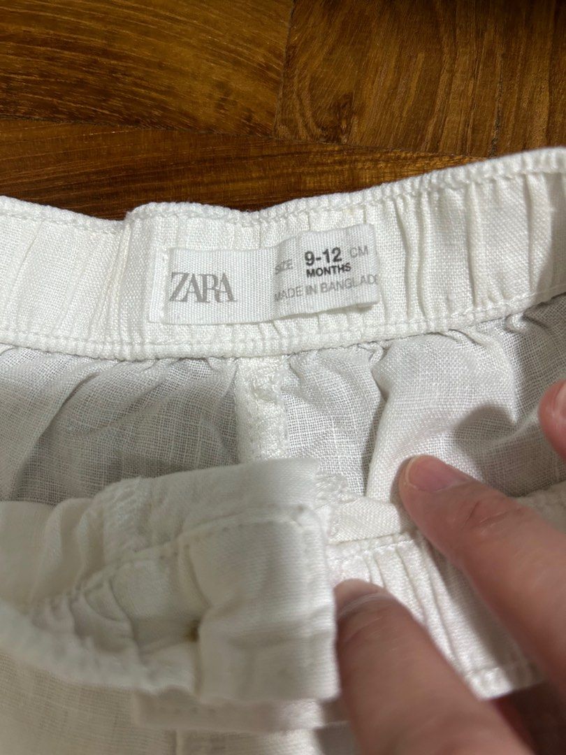 Zara White Linen Pants - 9-12 Months (Category: Babies & Kids Fashion) located in Singapore. Submitted by Lloyn21 (Listing ID 1378940656, Image 2). Description: White linen pants from Zara. Features two front pockets and an elastic waistband. Made in Bangladesh. Perfect for warm weather. In good condition, with minor signs of wear..