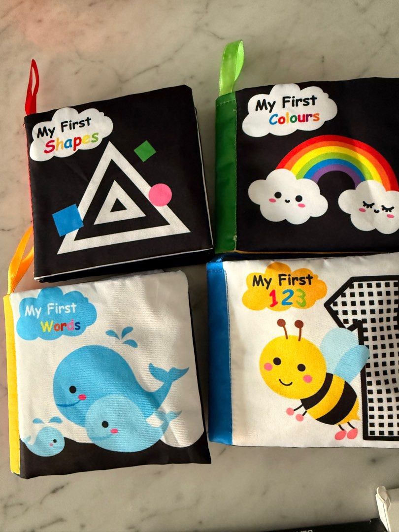 Baby Soft Books & Sensory Socks Set (Category: Infant Playtime) located in Singapore. Submitted by jojomomo (Listing ID 1379183769, Image 1). Description: This set includes four soft books: Shapes, Colours, Words, and 123s. Giving FREW: A set of sensory socks and wristlets for play time. Perfect for babies to explore shapes, colours, and textures. All items are in excellent condition. Strictly self collection Chat for exact location (beside sengk