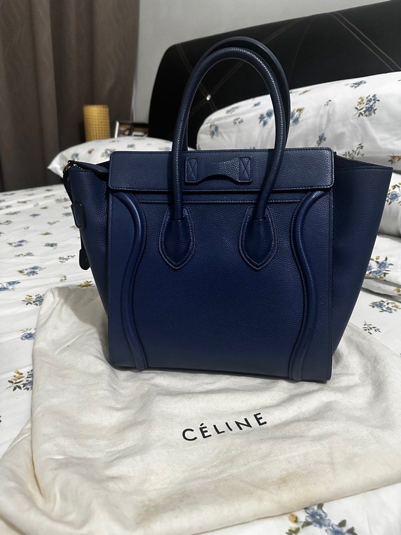 Celine Luggage Micro Handbag - Navy Blue (Category: Bags & Wallets) located in Singapore. Submitted by anargya0529 (Listing ID 1379275867, Image 1). Description: Authentic Celine Luggage Nano handbag in navy blue. Features a zip closure and a spacious interior. Includes dust bag. Made in Italy. Excellent condition, lightly used. Can Negotiate on Price. Year 2015.