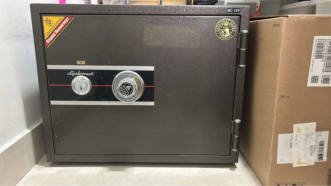 Pre loved Diplomat Safe MC-420 for only $150. Ideal safe for important documents, jewelry etc (Category: Safe) located in Singapore. Submitted by Paulinesoh (Listing ID 1379188232, Image 1). Description: Diplomat safe with a combination lock and key access. It has a brown exterior and appears to be in good working condition. Perfect for securing valuables. Please note that the safe is used and may have some minor cosmetic imperfections. Comes wit