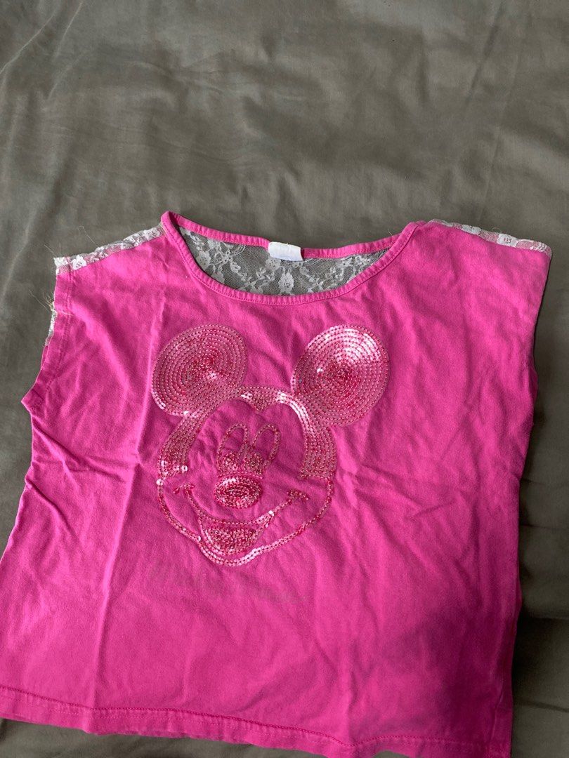 Disney Mickey Mouse Pink Top Size 12 (Category: Babies & Kids Fashion) located in Singapore. Submitted by kxool (Listing ID 1379187060, Image 1). Description: Adorable pink top featuring a sparkly Mickey Mouse design. It has a lace detail on the shoulders. The top is in good condition and perfect for any Disney fan..