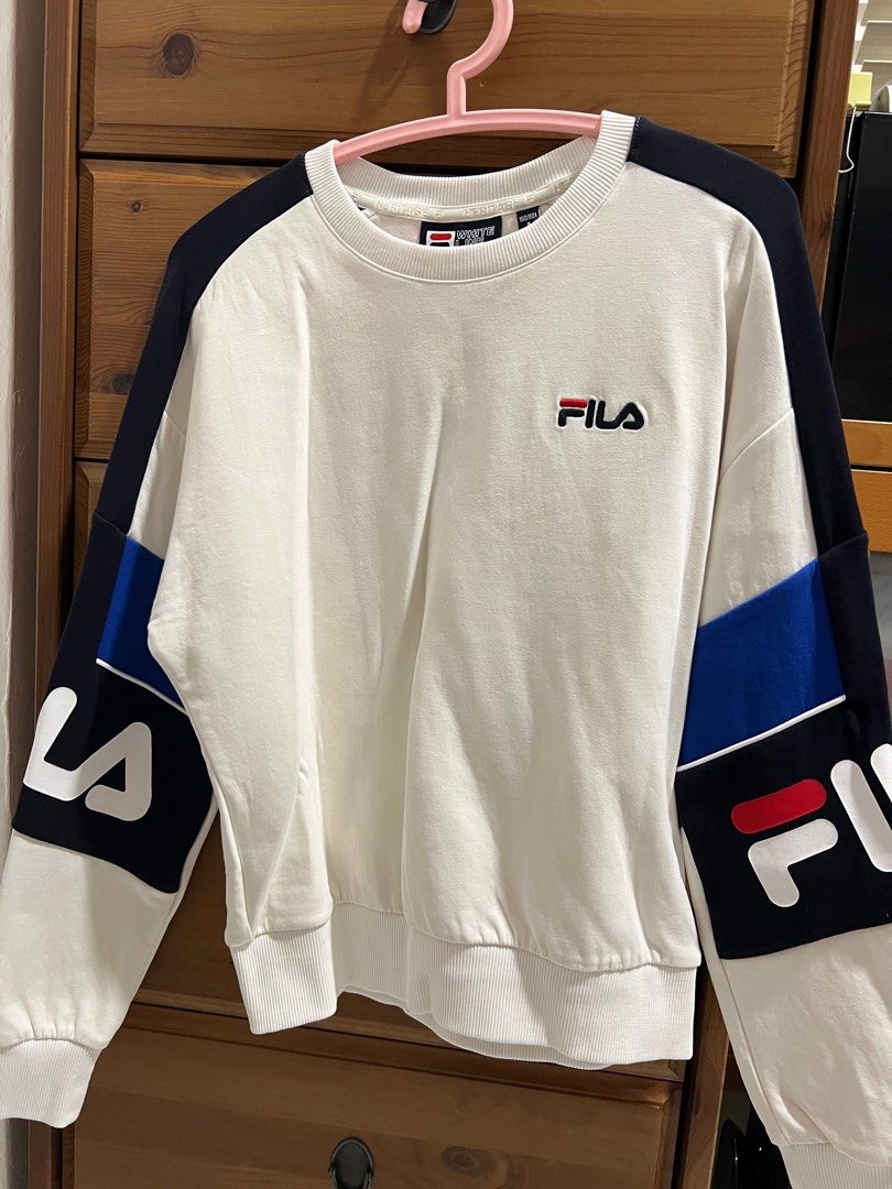 Fila pullover (Category: Longsleeves) located in Singapore. Submitted by helpmewithmythings (Listing ID 1379156813, Image 1). Description: Fila pullover, kids size But I am adult size UK 8 and it fits well with allowance Note the small discolouration as shown in pic..
