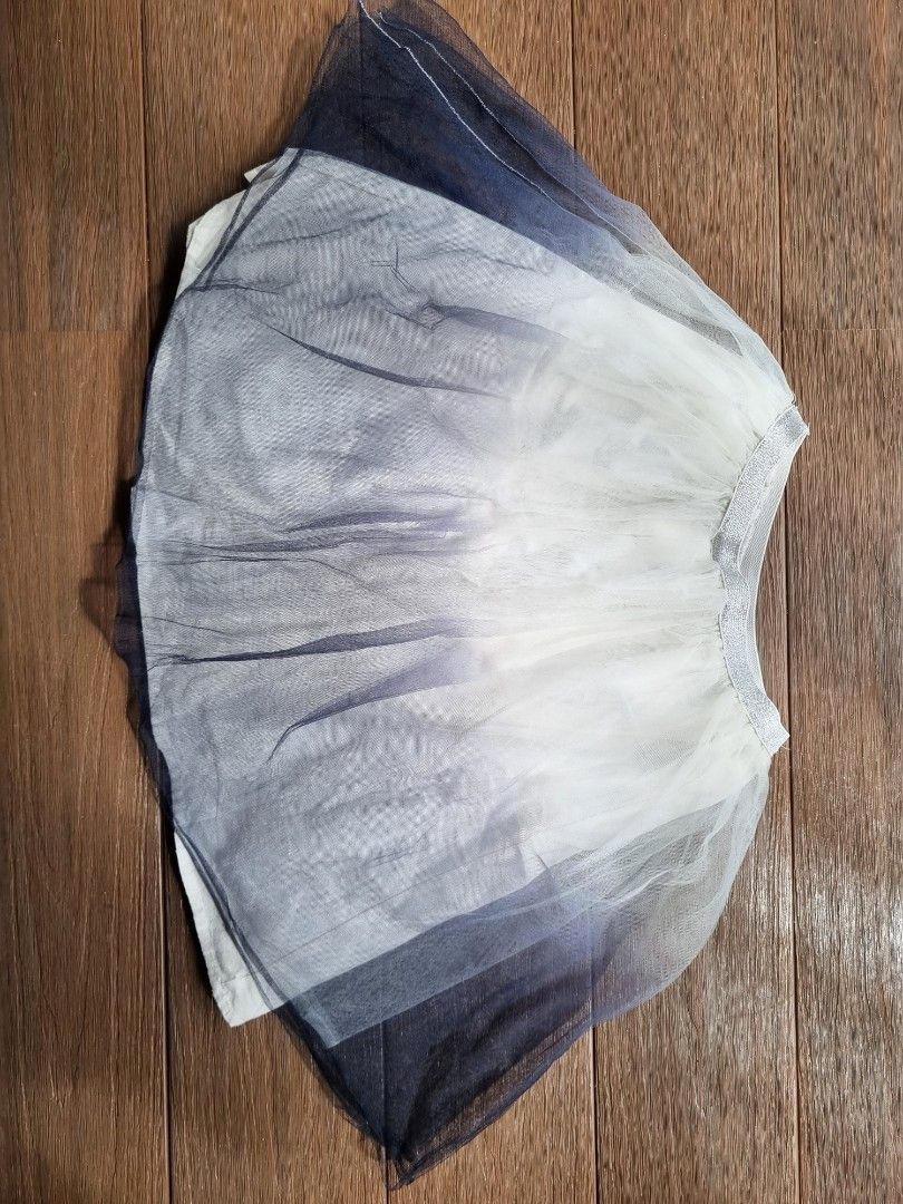 Frozen - Ombre Tulle Skirt (Category: Babies & Kids Fashion) located in Singapore. Submitted by lisafu79 (Listing ID 1379151839, Image 1). Description: - Frozen - Ombre tulle skirt - Colors: White, silver, and navy (tones of colours) - Comfortable elastic waistband - Gently used, excellent condition - Size 120/56cm (measurement around the waist skirt) -Age 6 years old onwards depending on the size of kids..