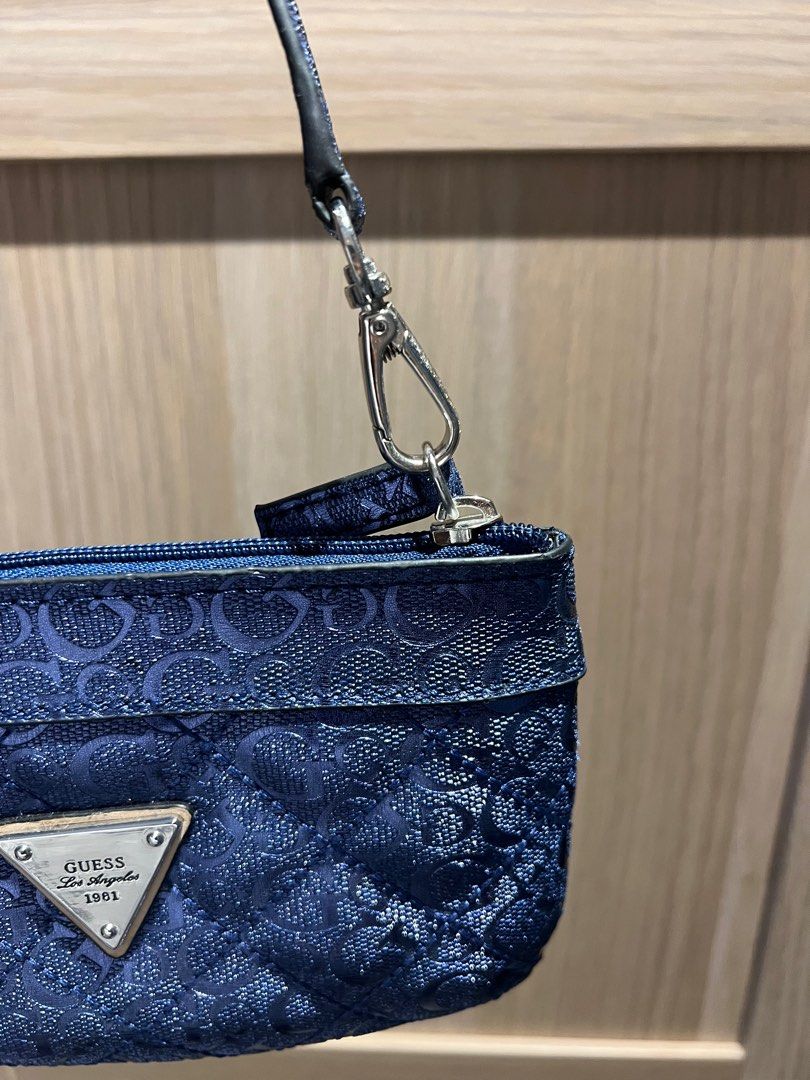 Guess Wristlet (Category: Purses & Pouches) located in Muntinlupa City. Submitted by Ariom (Listing ID 1379174463, Image 3). Description: Never used. No packaging. What you see is what you get. 12x18cm .