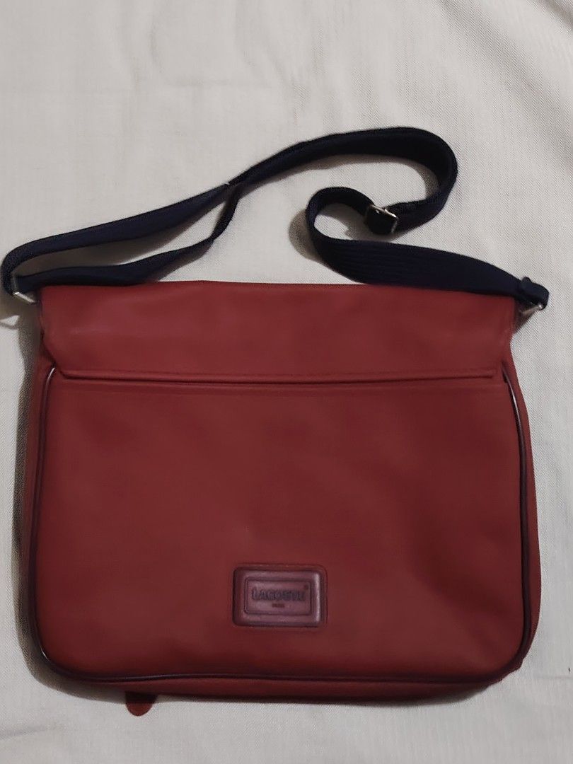 Lacoste messenger laptop bag (Category: Luxury Bags & Wallets) located in Quezon City. Submitted by sureandlegit (Listing ID 1379133938, Image 2). Description: 100% Authentic Lacoste Messenger bag / laptop bag Expandable Made in France Water repellant material Adjustable strap Can fit 13in Mac book with case perfectly Can be office or overnight bag 1 front zip pocket 2 front pocket 1 zip compartment inside 1 back pocket Rare Still in good conditi