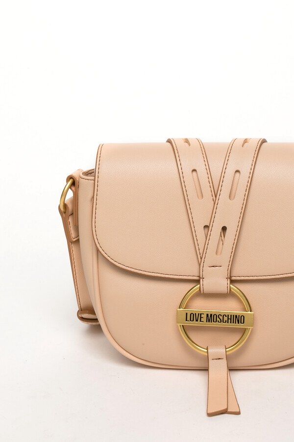 Love Moschino Round Buckle Shoulder Bag (Category: Bags & Wallets) located in Singapore. Submitted by huhoops (Listing ID 1379161247, Image 2). Description: Brand new with dustbag & tag Retail Price: $580 Please note that leather has some peeling at the back of the bag and side due to keeping it aside for quite some time Refer to picture for more details I have applied leather cream for the bag already to prevent the leather from further peeling.