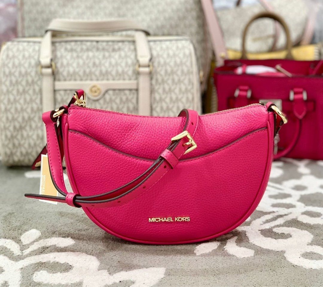 Michael Kors Dover Halfmoon Bag (Category: Luxury Bags & Wallets) located in Quezon City. Submitted by pinkandpurpleshoppe (Listing ID 1379252235, Image 1). Description: Michael Kors Dover Half Moon Crossbody Bag Design: It’s crafted from soft pebbled leather in a sleek, crescent-shaped silhouette, inspired by popular ‘90s handbag styles. Dimensions: It measures approximately 24.13 cm (W) x 17.14 cm (H) x 13.33 cm (D). Interior and Features: The 