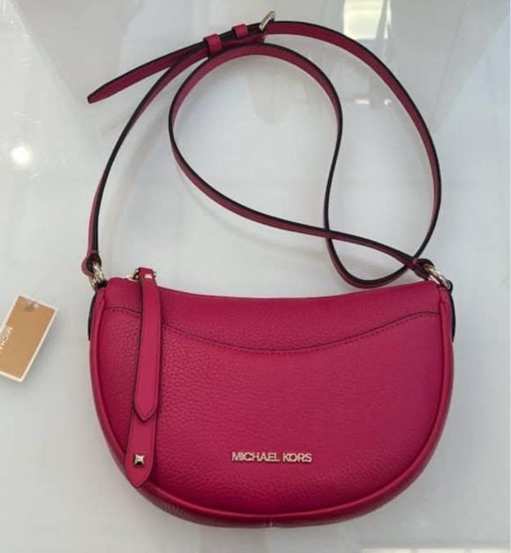 Michael Kors Dover Halfmoon Bag (Category: Luxury Bags & Wallets) located in Quezon City. Submitted by pinkandpurpleshoppe (Listing ID 1379252235, Image 2). Description: Michael Kors Dover Half Moon Crossbody Bag Design: It’s crafted from soft pebbled leather in a sleek, crescent-shaped silhouette, inspired by popular ‘90s handbag styles. Dimensions: It measures approximately 24.13 cm (W) x 17.14 cm (H) x 13.33 cm (D). Interior and Features: The 