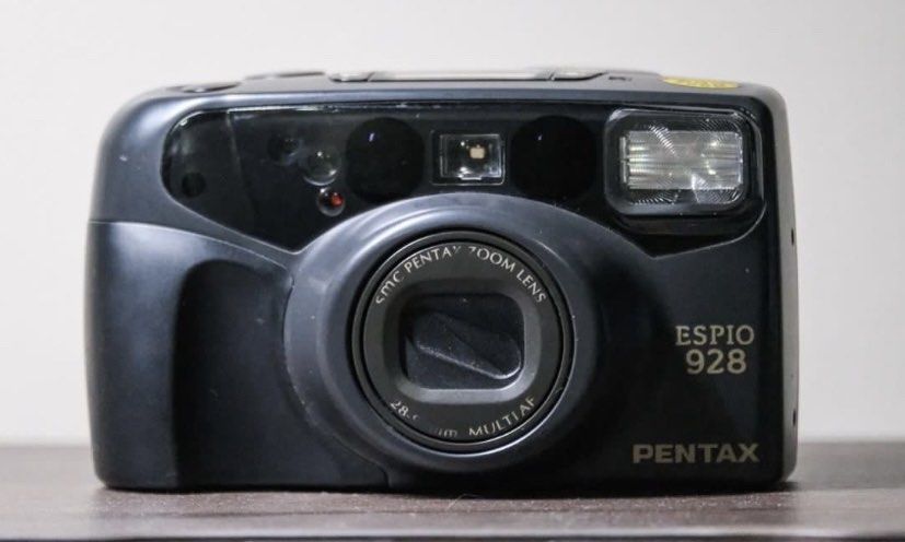 Pentax Espio 928 (Category: Cameras) located in Paranaque City. Submitted by prelovedbyitc (Listing ID 1379194247, Image 2). Description: Specifications: - Camera Type: Compact 35mm point-and-shoot film camera - Lens: Pentax power zoom lens 38-120mm, f/4.1-8.7 - Viewfinder: Real-image zoom viewfinder - Film Format: 35mm film - Shutter Speeds: 1/400 to 2 sec (automatic) - Exposure Modes: Fully automatic with programmed AE - Flash Modes: Auto flash