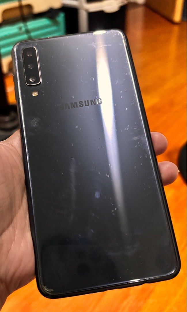 Samsung Galaxy A7 | 4 GB+64 GB (Category: Samsung) located in Quezon City. Submitted by Third (Listing ID 1379151693, Image 2). Description: Samsung Galaxy A7 | 4 GB + 64 GB -Battery easily gets drained, might need replacement (needs to be charged twice a day) -Never been repaired -Touch and Face ID working -Power button needs to be pressed hard for it to open -With free earphones and phone casing -Charger not included *Videos available upon requ