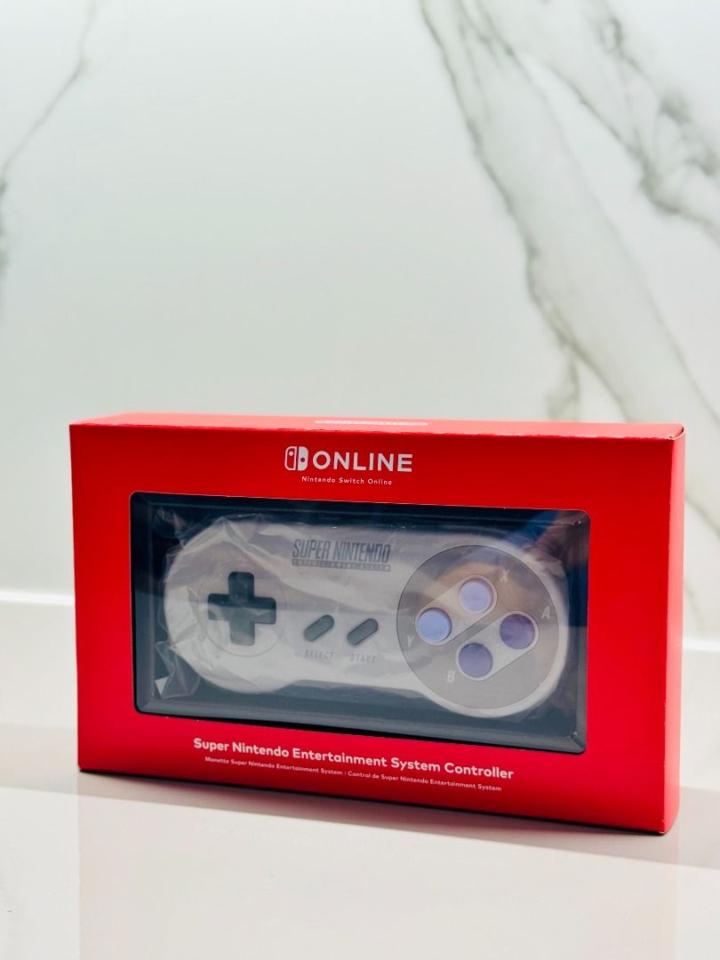 Super Nintendo (SNES) Controller for Nintendo Switch Online (Category: Nintendo) located in San Juan City. Submitted by dit801 (Listing ID 1379195033, Image 1). Description: Super Nintendo (SNES) Controller for Nintendo Switch Online US-exclusive for Nintendo Switch Online subscription members Purchased from Nintendo Store New York • Official Controller for Nintendo Switch Online (NSO) to play Super Nintendo Entertainment System (SNES) and Super 