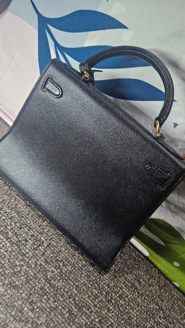 TAKIE Leather Handbag (gold hardware) (Category: Purses & Pouches) located in Quezon City. Submitted by coolbeans02 (Listing ID 1379309870, Image 2). Description: TAKIE Leather Handbag (gold hardware) Still in very good condition Missing lock ₱500 Message for any questions!.