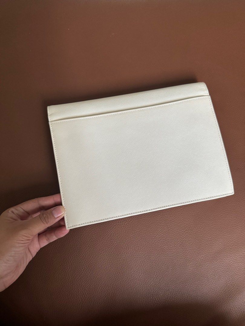YSL Vintage Clutch (Category: Luxury Bags & Wallets) located in Manila. Submitted by chenyamsuan (Listing ID 1379195424, Image 2). Description: Preloved YSL vintage clutch - Japan-bought Free bag insert / chain (No brand) para pwede syang shoulder bag May minor flaw inside pero hindi sya sya sagabal, maganda and clean pa yung loob .